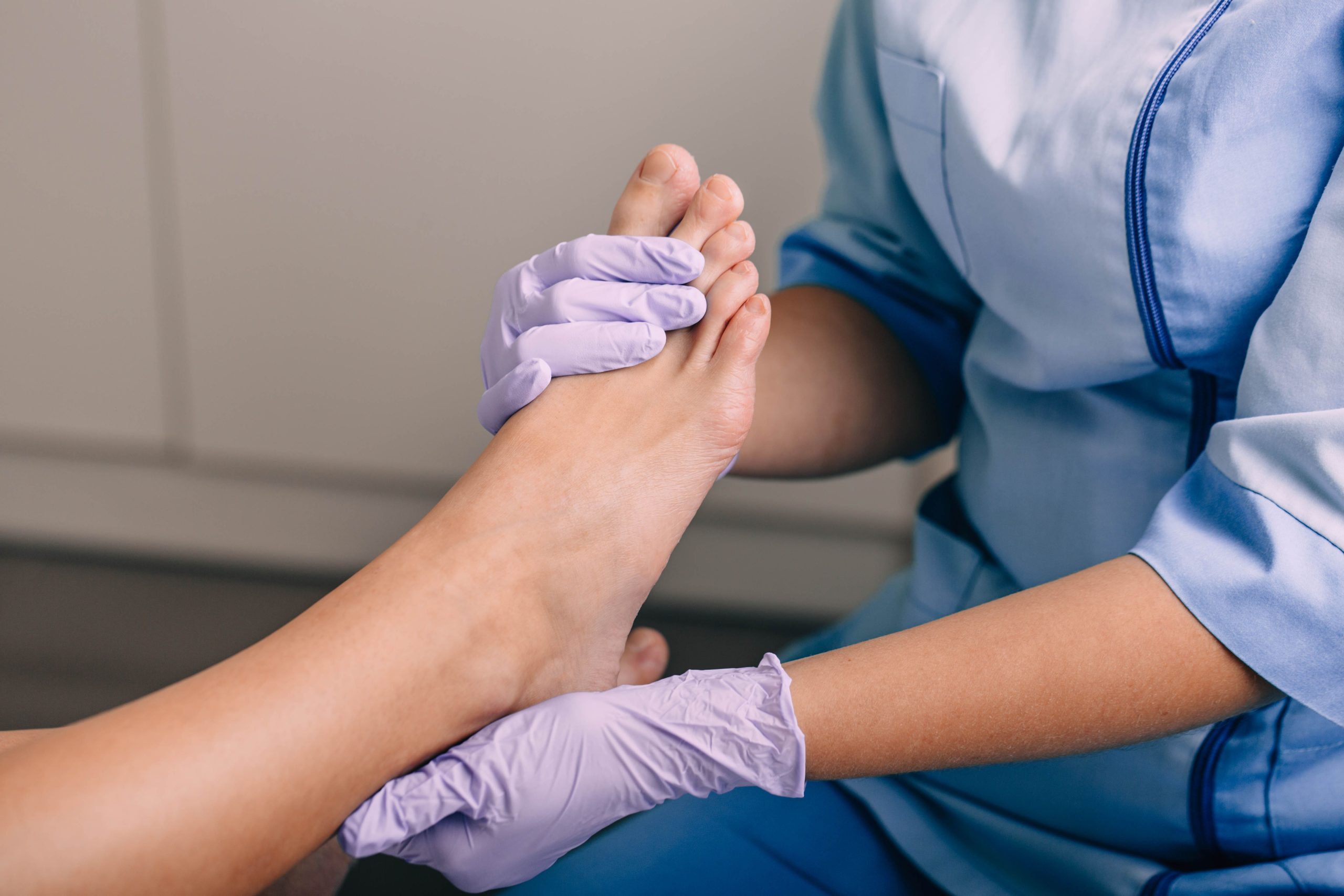 Image adult cares for foot wearing purple gloves 2026 01 08 23 31 15 utc (1)