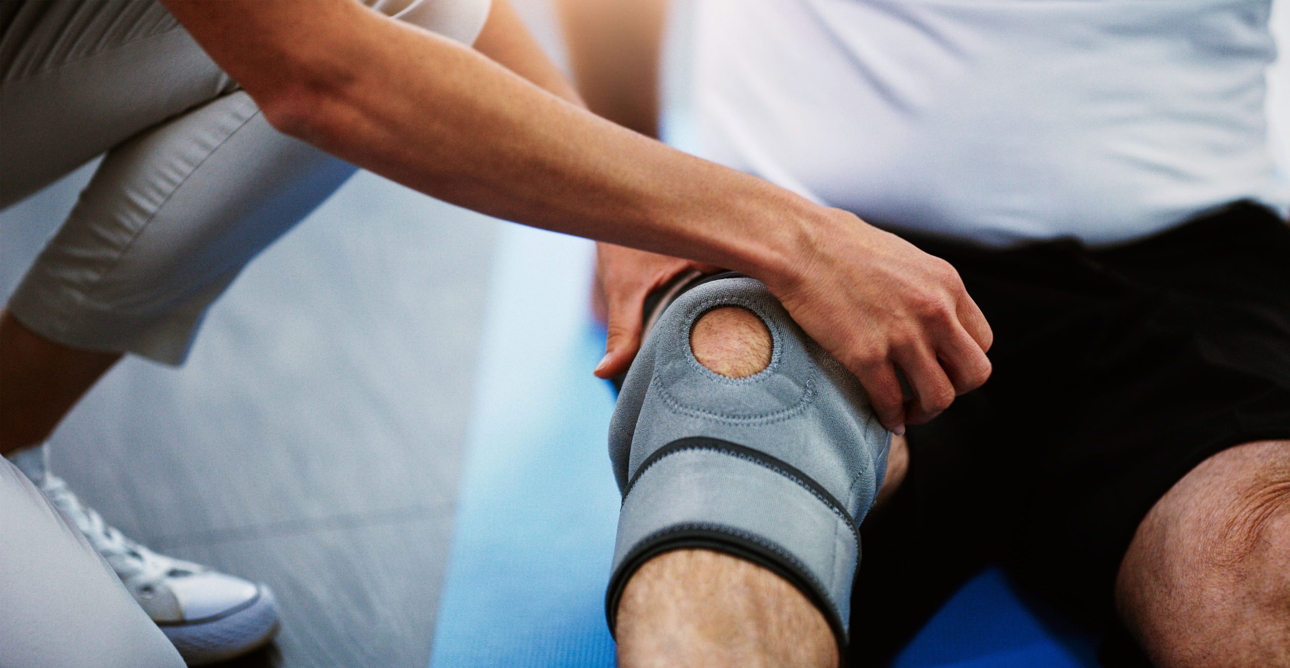 Image medical professional inspects knee brace on patien 2026 01 09 10 24 36 utc (1)